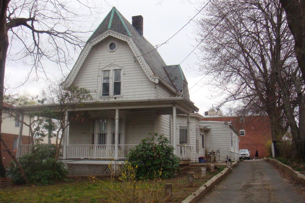 WELCOME TO THIS LARGE 2 FAMILY ON A TRIPLE LOT! THE FIRST FLOOR FEATURES A 2BR APARTMENT WITH AN UPDATED KITCHEN AND BATH, LIVING ROOM AND A FORMAL DINING ROOM WITH A MARBLE FIRE PLACE. **BONUS 1BR APT ON THE FIRST FLOOR WITH SEP ENT!** 2ND FLOOR IS A 2BR APT WITH A FINISHED ATTIC. THIS HOME ALSO FEATURES A FULL FINISHED BASEMENT WITH A FULL BATH, UTILITY ROOM, STORAGE ROOM AND LAUNDRY AREA. 5 CAR GARAGE WITH ADDITIONAL AMPLE PARKING. ROOF WAS UPDATED IN 2007, NEWER FURNACE (2005), NEWER WATER HEATERS (2005, 2006). HOME BEING SOLD AS IS. ZONED COMMERCIAL, POSSIBLE 3 FAM. 