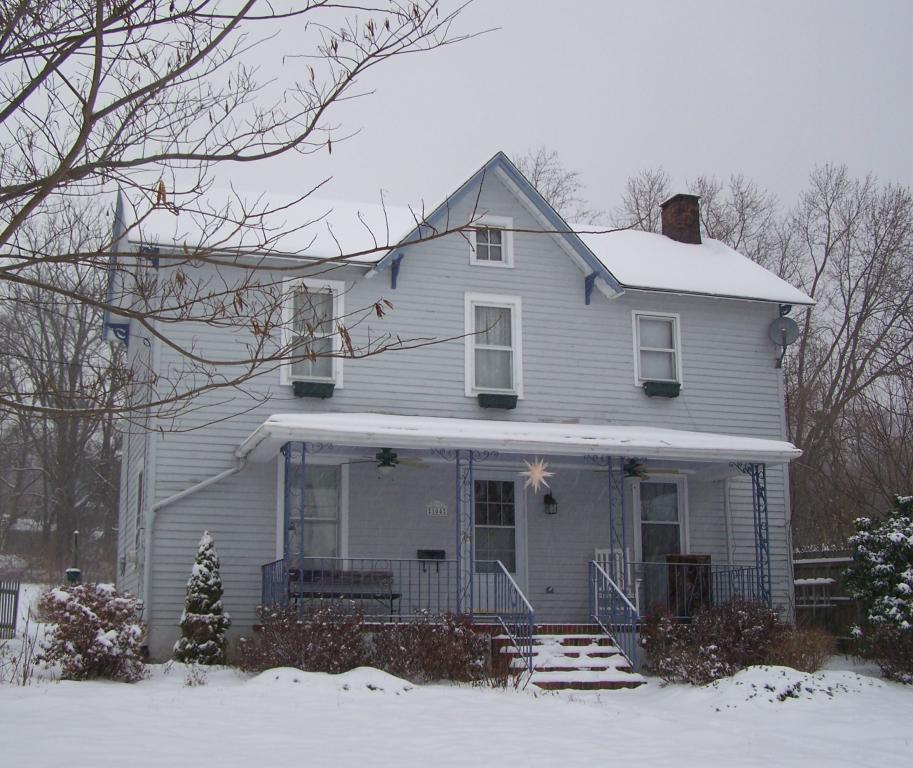 Late 1890s colonial with architectural elements reminicient of an old century farmhouse. Many historic features combine old world charm with modern amenities: Central Air, Public Water &amp; Sewer, Pine plank floors, some original panel doors &amp; trim, patterned hinges, engraved banister, built-in shelves and so much more...  Covered side porch leads to rear patio which is situated on oversized 1/2 acre property.  Shed includes Air Conditioning, Electric, Water, Telephone, Ethernet &amp; pet accommodation area.