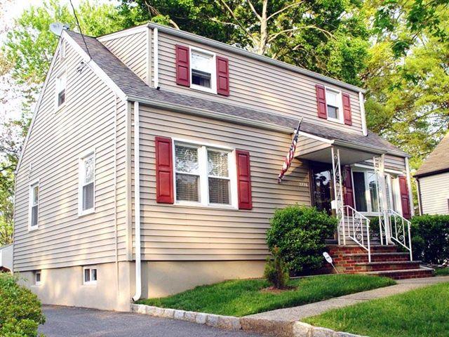 Immac. home w C/A, new thermal windows&amp;front door, updated EIK wl SS appliances, maintenance free vinyl siding,HW flrs, 2 updated full baths, finished besement.This home shows true pride in ownership Ample parking for 5 or more cars, deck, wonderful deep level lot,  minutes to  GSP, train to NYC, parks, schools, and shopping