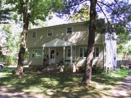 Enjoy the in-town location on a quiet street with a great view of the river!  Invest, or live on one side and rent the other.  Fully remodeled bath in unit 1. Beautiful hardwood floors in both units. 