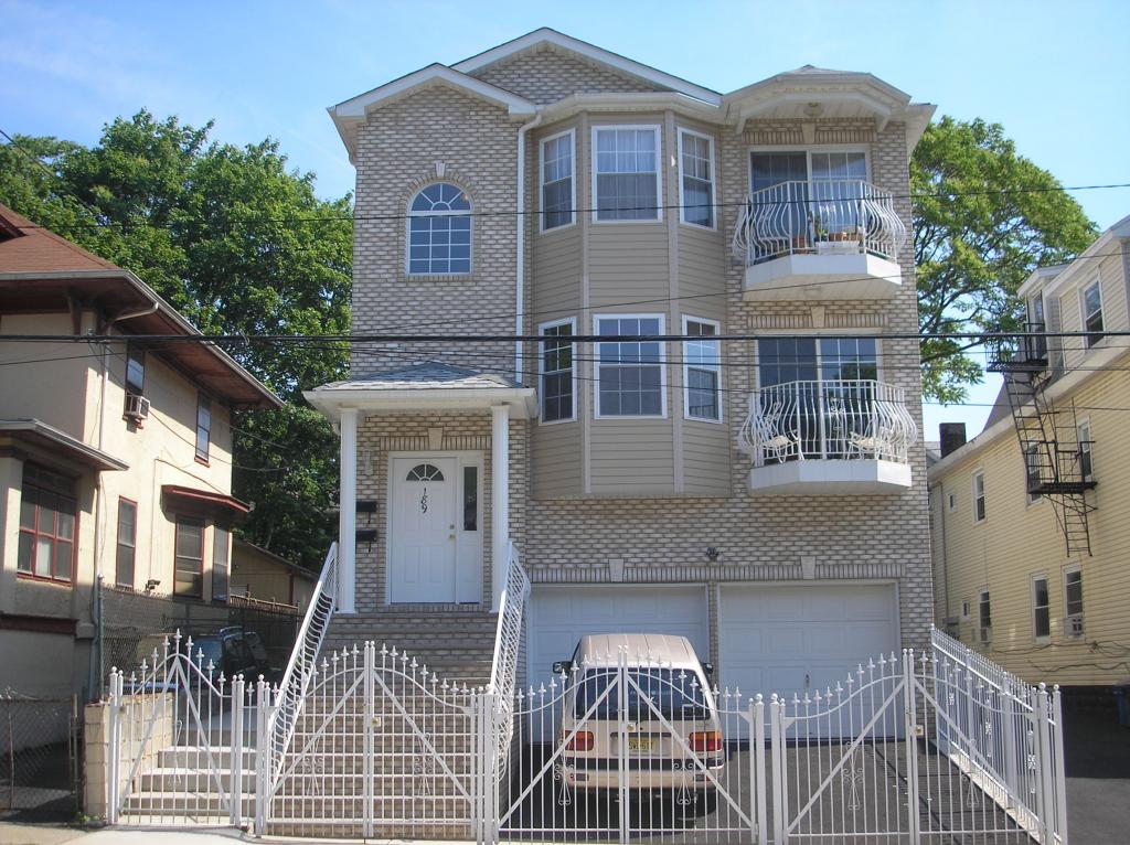 Beautiful  newer 2 family w/LR,DR,EIK,3 Bedrooms, 2 Baths H/W floors on each level, 1/2 Bath &amp; 2 rooms on Ground Level,2 Car Garage 
