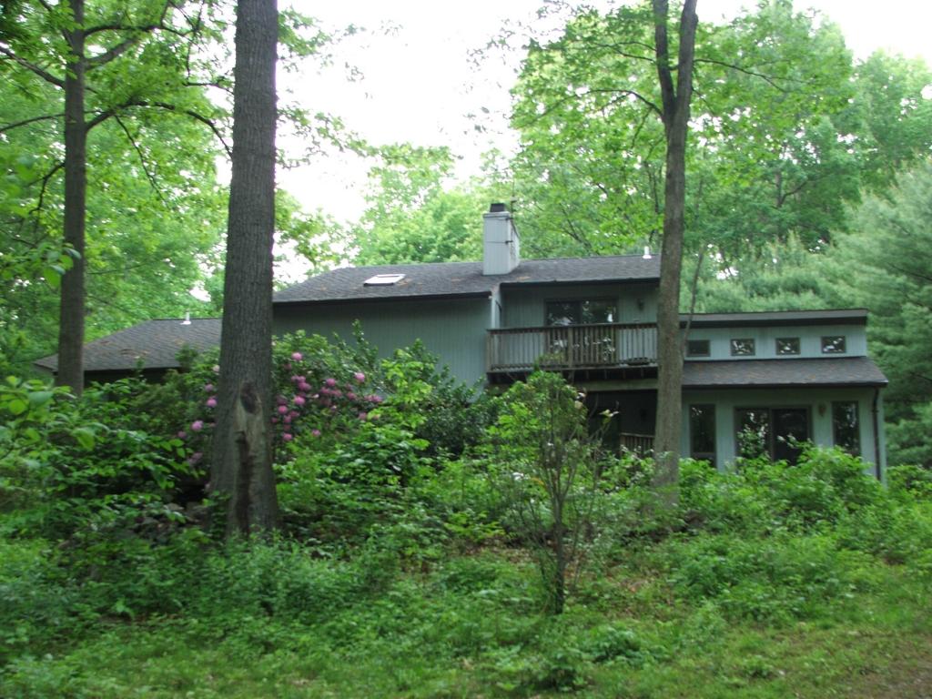 VERY PRIVATE!  LONG DRIVE LEADS UP TO THIS CONTEMPORARY HOME ON 6.26 ACRES.  HOME OFFERS 3 BDRMS, 2.1 BATHS, 3 FP's, HARDWOOD FLRS, CATHEDRAL CEILINGS, GREAT KIT W/CENTER ISLAND, MASTER BEDROOM W/FULL BATH &amp; FP, LOFT AREA, FORMAL LIVING RM W/FP, FAMILY RM W/FP, OFFICE, LAUNDRY RM OFF KITCHEN, FULL BSMNT W/EXERCISE RM, 2 CAR GARAGE, LARGE BACK DECK.  EASY ACCESS TO MAJOR ROADWAYS, SCHOOLS &amp; SHOPPING!
