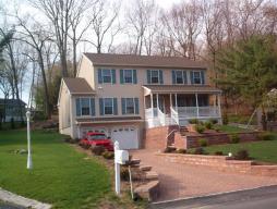 Hallmark home built 2005,Like new! DW, Stove &amp; Fp newer used,Beautiful hardwood 1st flr,FP in FR,Front porch mahagony floor,oak cab-kit, ceramic tile Baths,cus walls &amp; paver Driveway &amp; walkways,CV&amp;AC. Steel I Beam const, poured foundation, full bsmt, 2 car gar/openers, mstr BR suite w/walk-in closet &amp; jacuzzi,oversized shower.