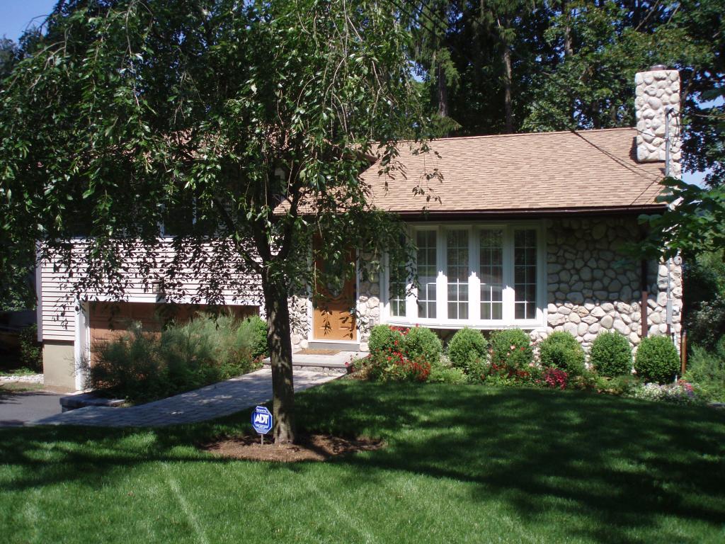 This home is like new, totally renovated, year round lake views, a vacation home-seldom used.  Light, Airy and Clean as a whistle! Three bedrooms, two bedrooms, beautiful kitchen w/granite counter tops, central a/c and two car garage.