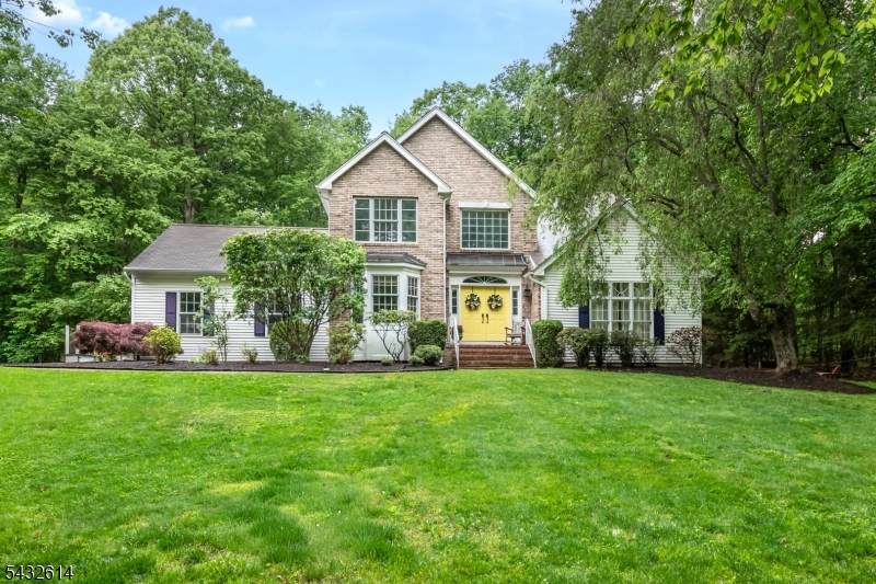 Front Elegant brick front Colonial majestically set on almost 3 acres