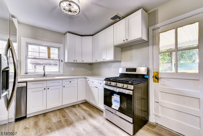 Custom Kitchen Walk out to patio and backyard