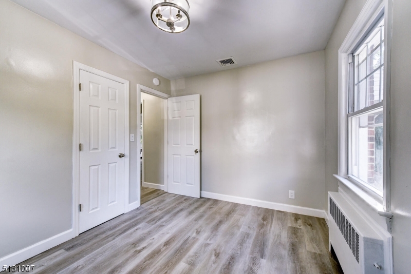 Bedroom 2 Laminate Flooring Window Overlooking  the backyard