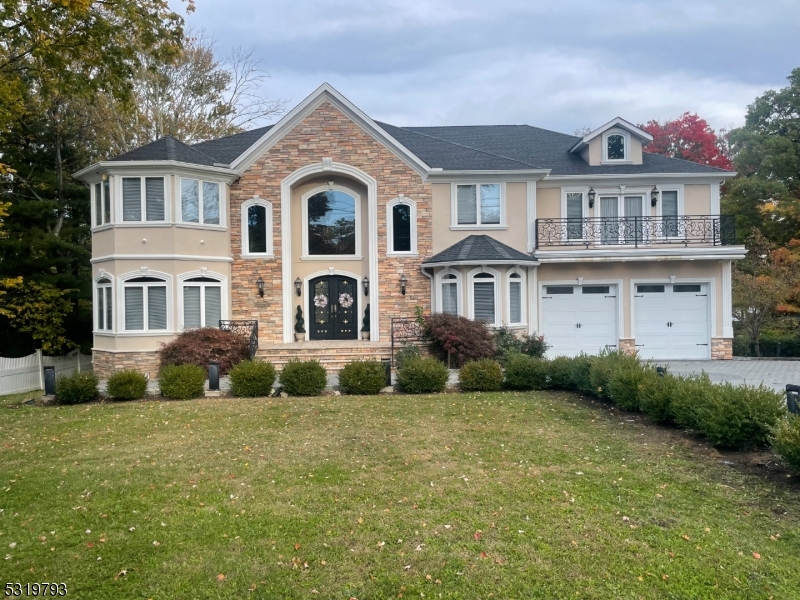 Gorgeous custom 4 bedroom 4 bathroom Center Hall Colonial nestled on a well manicured lot.