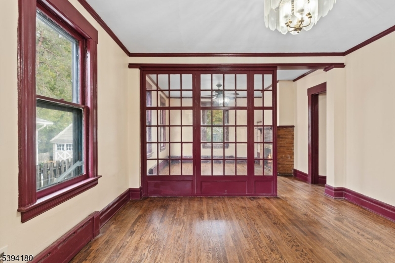 Dining Room Original glass panels from porch- used as glass panel room divider.