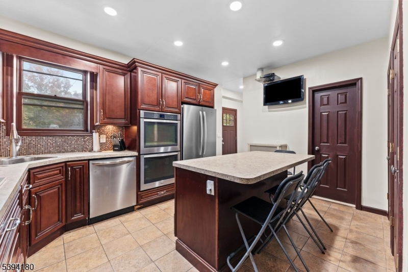 Kitchen Renovated eat in kitchen, new gas cooktop, double ovens. Large island with room for 4.