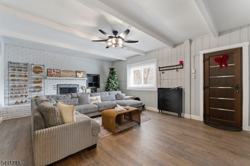 Enjoy the spacious family room w/ a totally renovated full bath and bedroom/den ideal for guests or an in-law suite