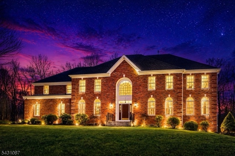 Stunning full-brick Colonial set on a lush, manicured lot in a sought-after cul-de-sac location. Arched Palladian entry window, classic white trim, and timeless architecture make for an unforgettable first impression.
