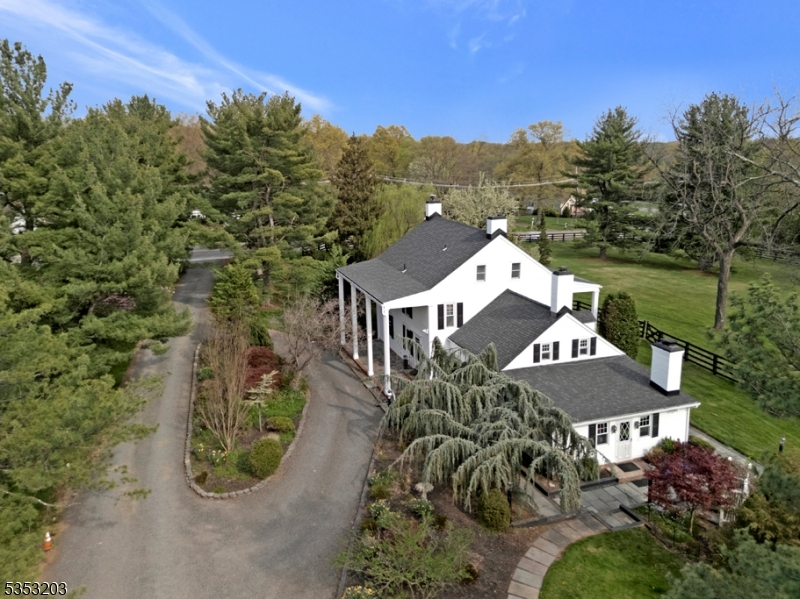4.9 acres of peaceful country living. Featuring a 5 bed colonial, 2 bed cottage and 3 stall horse barn
