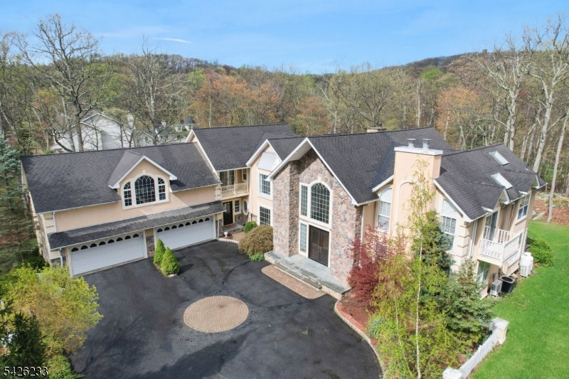 Sprawling 5 bedroom estate backing to private wooded area.