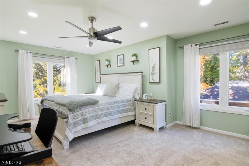 PRIMARY BEDROOM Big windows bring the natural light in.