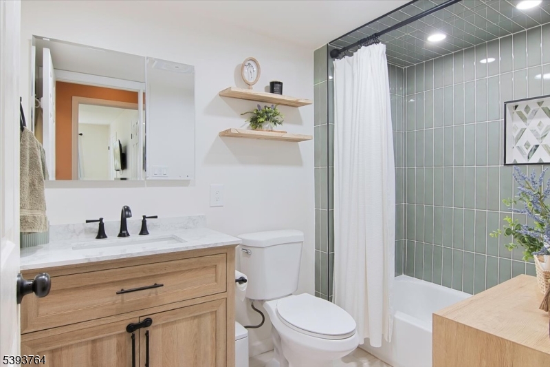 MAIN FULL BATH Gorgeous fixtures and tile work.