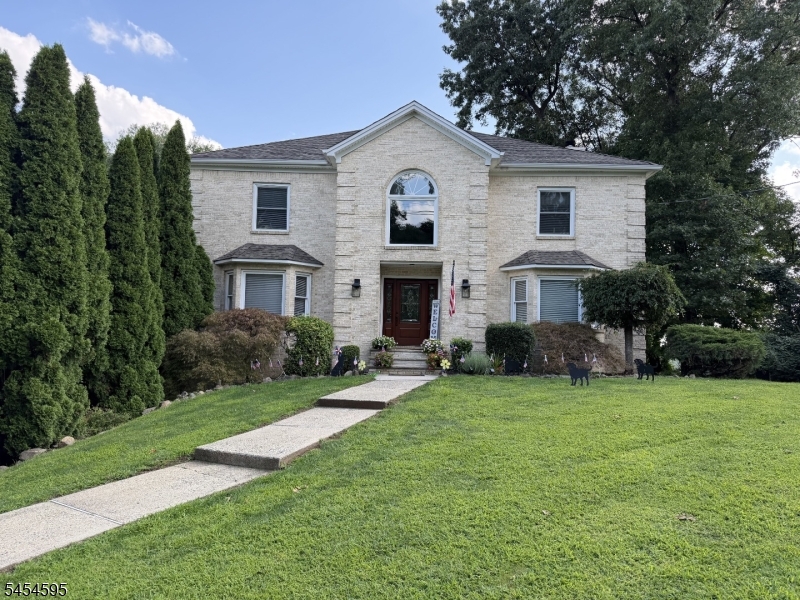 Welcome home to this well-maintained 4-bedroom, 3.5bathroom Colonial set high on a beautifully manicured lot, offering privacy, curb appeal and an impressive presence.