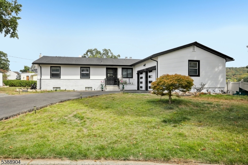 Welcome home to this exceptional 3 bedroom 2 bathroom open concept Ranch with what might be the BEST panoramic views of the lake in town!