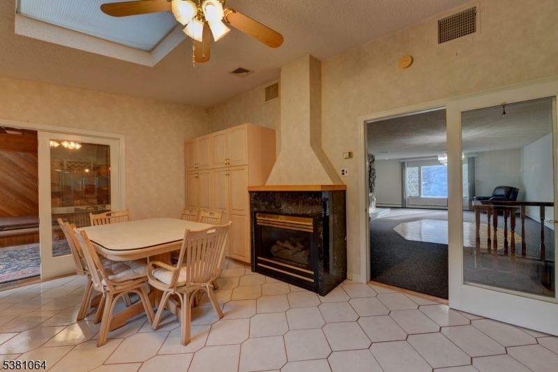 Eat-in kitchen Kitchen has an electric fireplace.