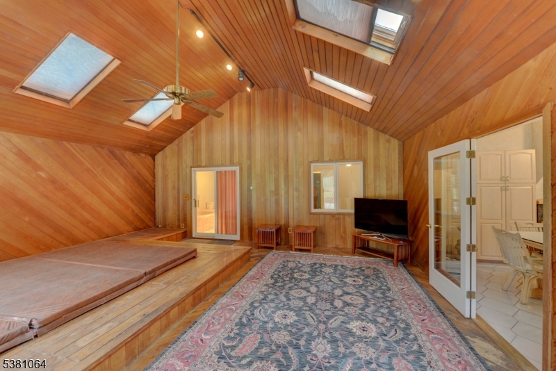 rear spa room Spa room is off the kitchen and leads to main bath.