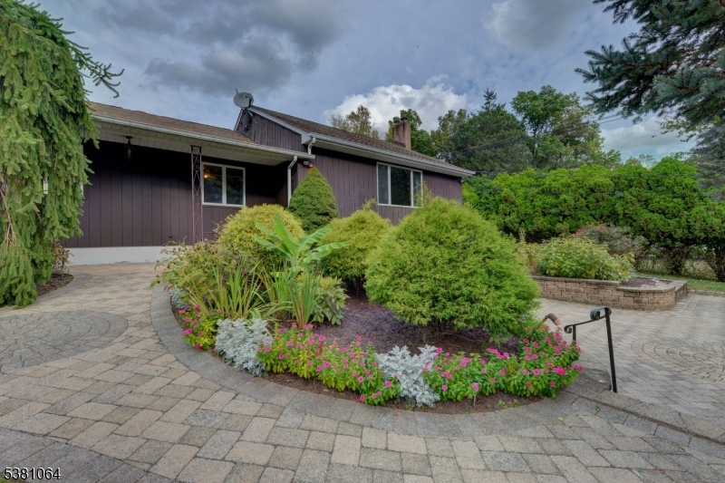 front walkway Paver walkway to the front door and beautiful landscaping.