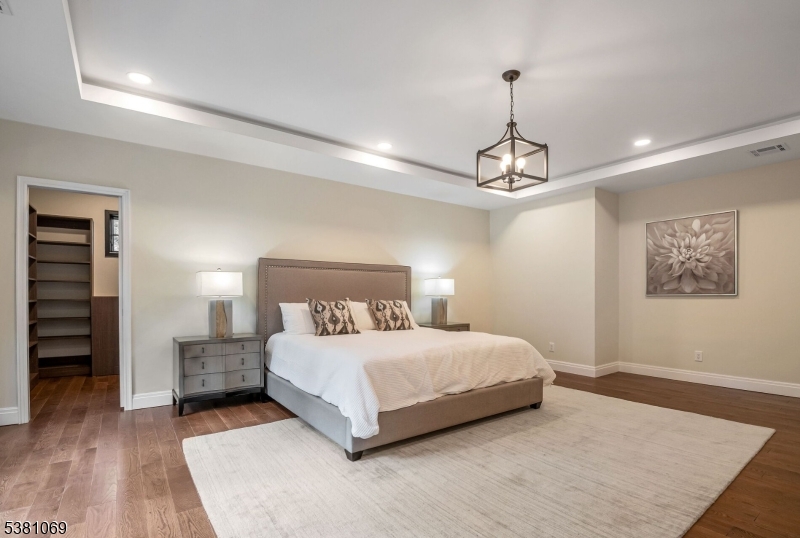 Primary Bedroom Recessed Lighting and Coffered Ceilings