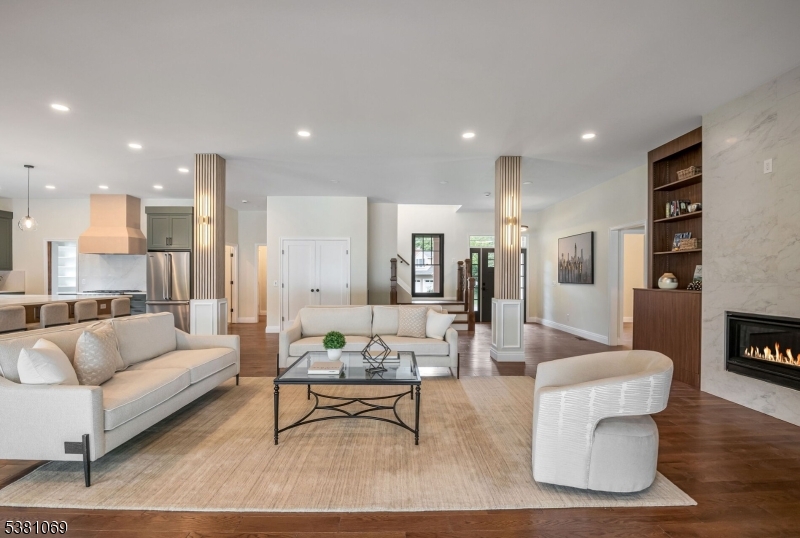 Living Room Additional Recessed Lighting and Sconces for an Added Modern Touch