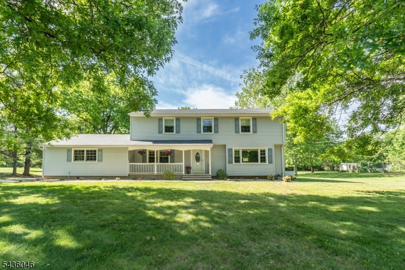 Front View With inviting rocking chair front porch