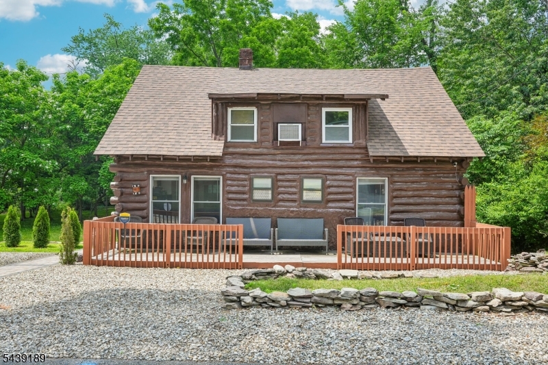 Welcome Home! Welcome home to this authentic log cabin retreat nestled on a picturesque wooded lot in the heart of Wayne.