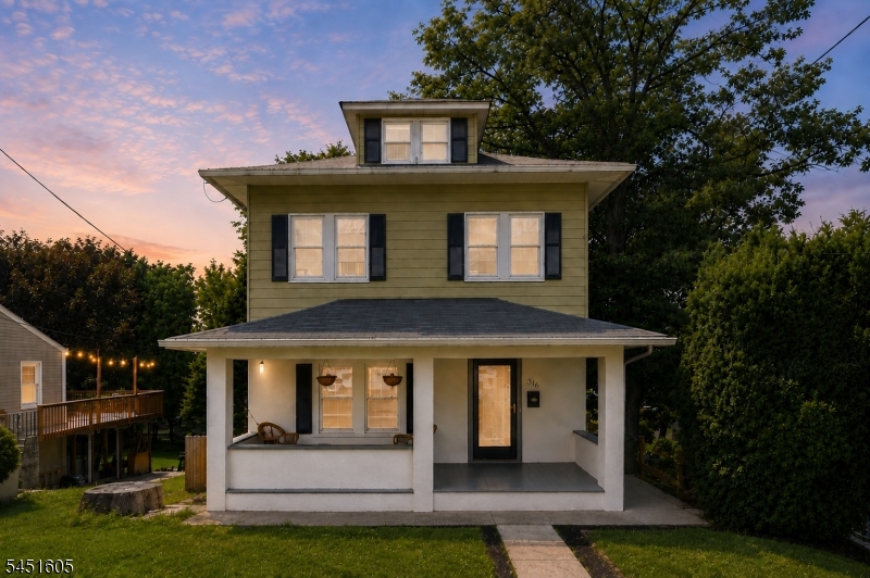 Enjoy peaceful morning coffee on this spacious rocking chair front porch!