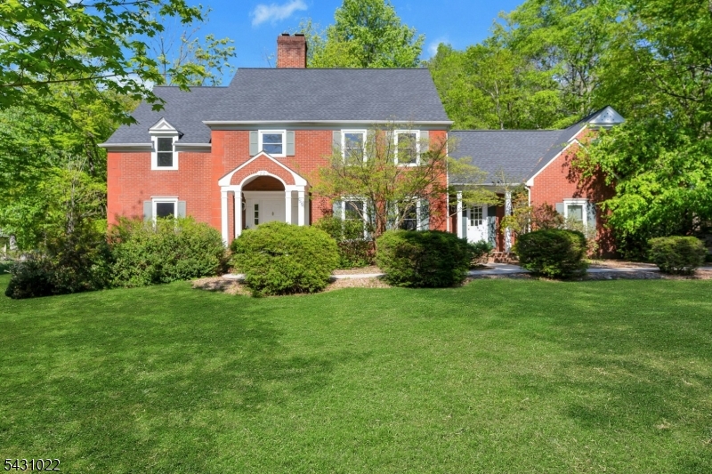 Front Exterior Classic colonial set on a beautifully landscaped property with exceptional curb appeal.