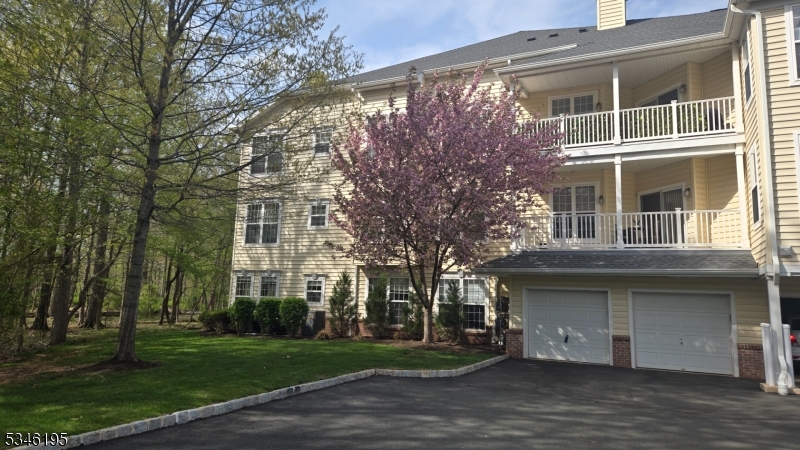 Garage with private entrance into the condo. Wonderful 1st floor end unit with private, wooded location