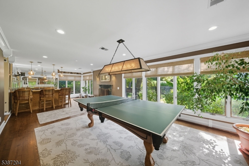 Games Room. Large room with many windows overlooking the front, side and rear gardens.