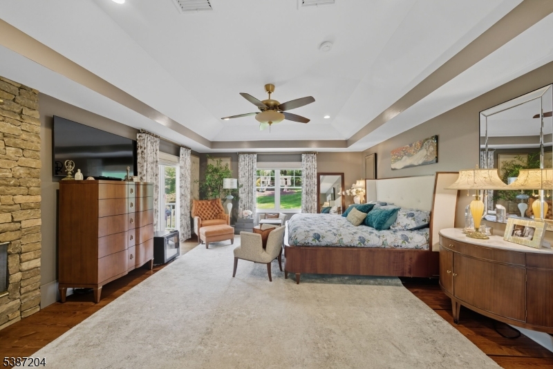 Primary Bedroom. The perfect retreat. Balcony overlooking the rear yard. Large closet and custom bathroom.