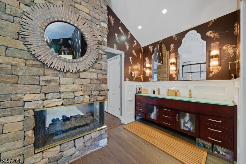 Primary Bathroom. Custom bathroom with gas fireplace.