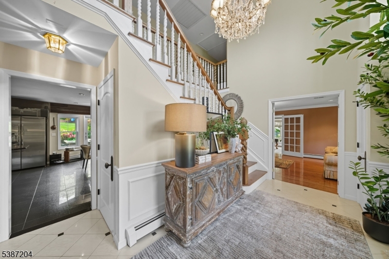 Entryway. View into the living room and Kitchen.