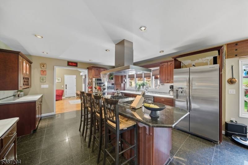 Kitchen. Large center island and plenty of storage space.