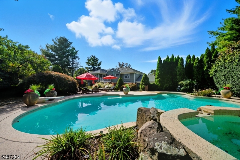 Pool. Beautiful landscaping with pool and spa.