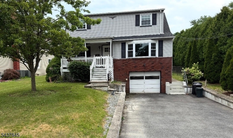 Covered Porch w/swing; walk to town, schools, shops, dining; the ultimate convenient location