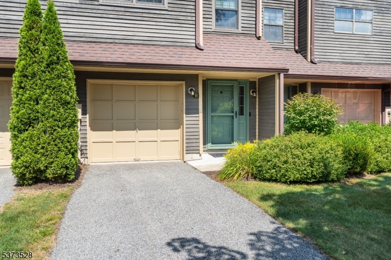 Front of unit with one car garage