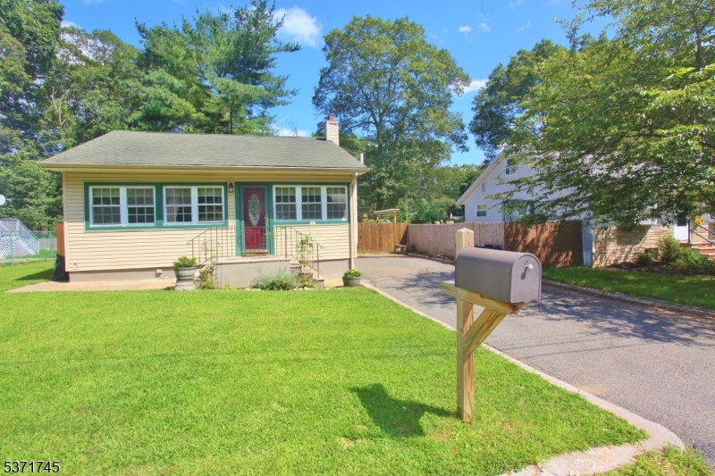 Bigger than it looks! Plenty of Parking on a nice flat lot with fenced in Back Yard!