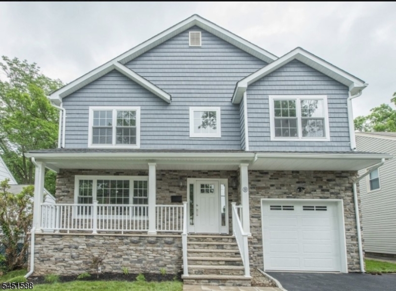 Stone and Vinyl Siding, 2 car width driveway, Fenced in Backyard, Open Porch.