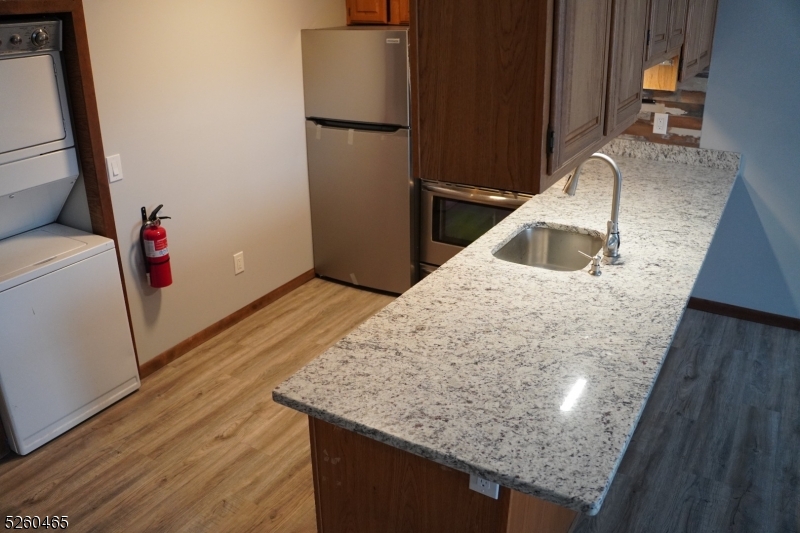 Kitchen has new refrigerator, new sink , new counter and the entire condo has new floor coverings.