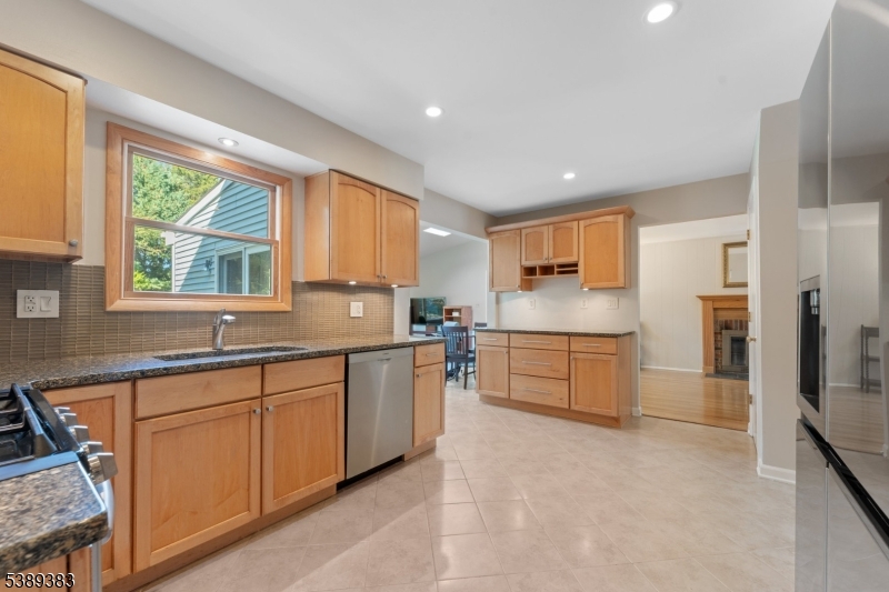 Kitchen Kitchen with tile floor, open to the den and family room.
