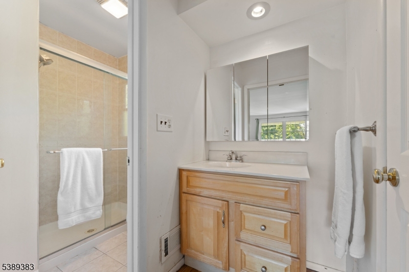 Primary Bath Primary en-suite bathroom with stall shower.
