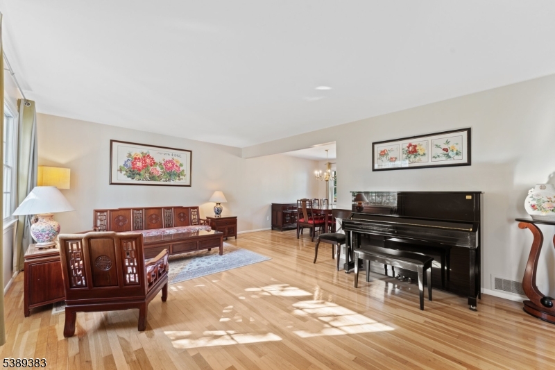 Living Room Living room with hardwood floor, open to the dining room.