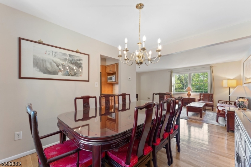 Dining Room Dining room with hardwood floor, open to the living room and kitchen.