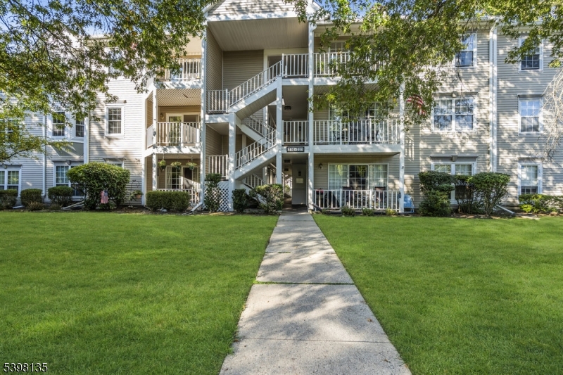 Welcome to 212 Larch Lane View from the parking lot to the entrance of the building