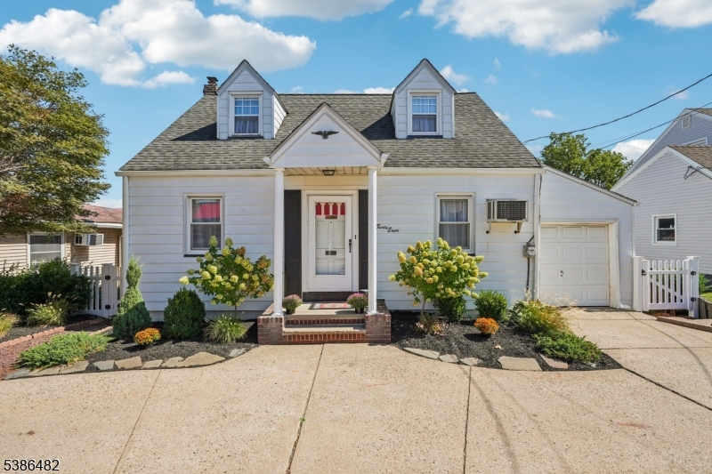 Welcome home to this charming 3 bedroom 1.5 bathroom Cape Cod perfectly nestled on a beautifully manicured lot in the heart of Wood Ridge.