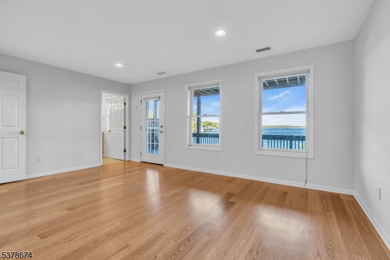 Access to lower deck Finished lower level offers full bath and access to lakefront covered deck just steps away from the dock.